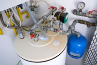 Unvented hot water cylinder with valves and expansion vessel